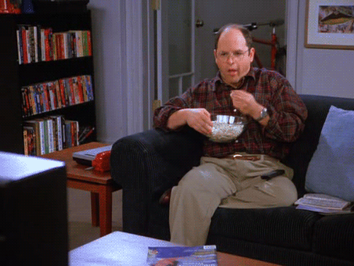 george-from-seinfeld-eating-popcorn-on-couch